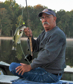 Phil with fly rod and Largemouth Bass